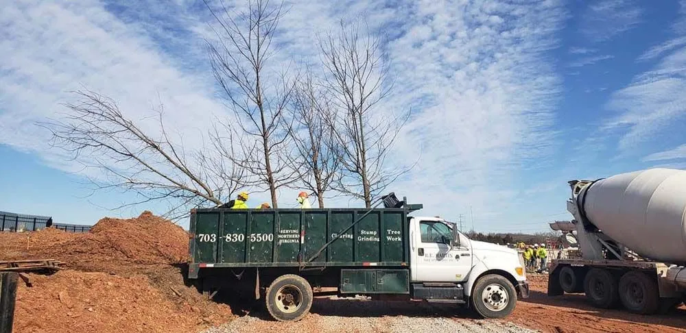 Work truck at active construction and clearing job site